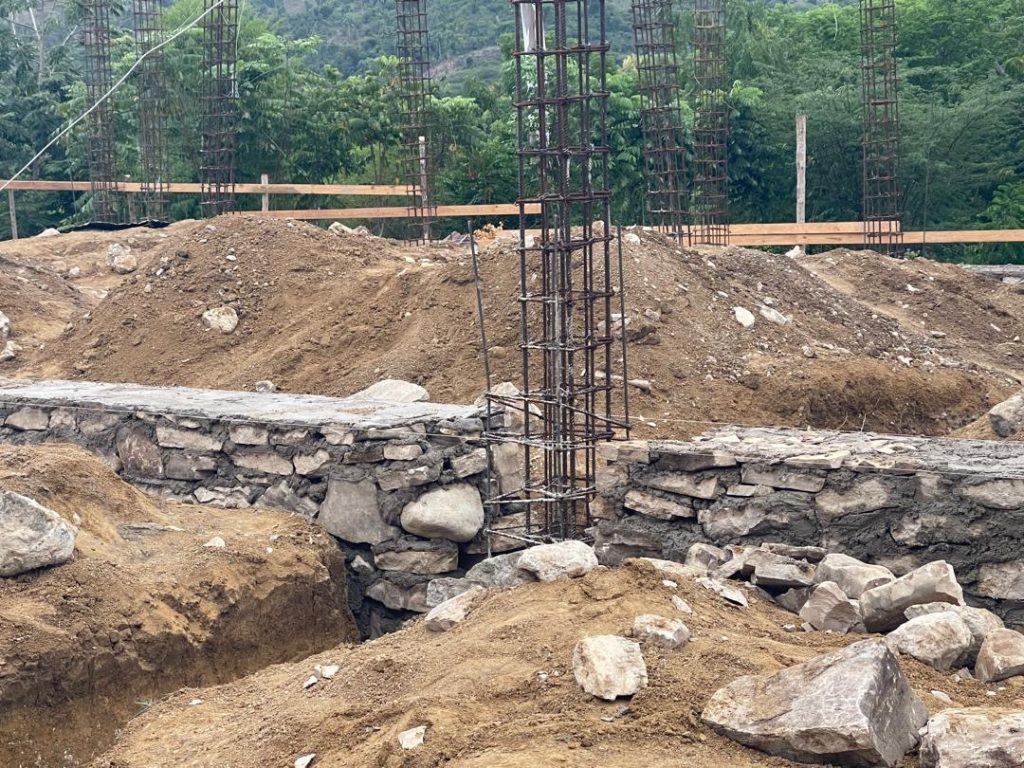 Stone foundation walls and steel column reinforcement